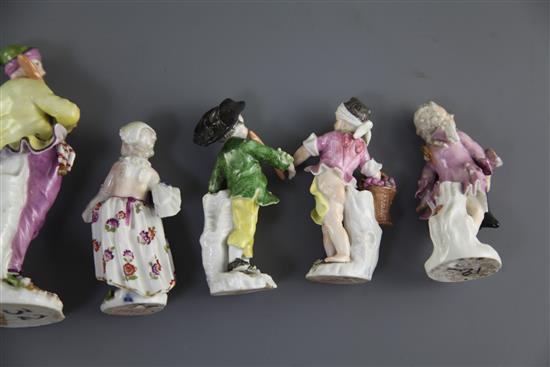 A Meissen figure of a baker and six Meissen Cupid in Disguise figures, all c.1750-70, 13.5cm and approx. 9cm (faults)